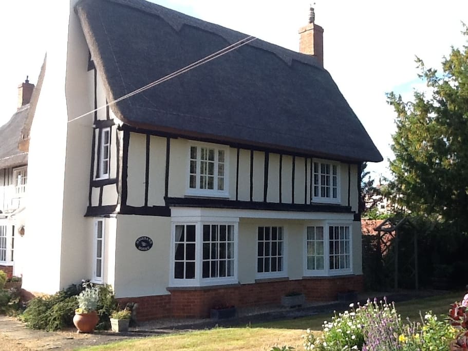 king sized bed in beautiful thatched house
